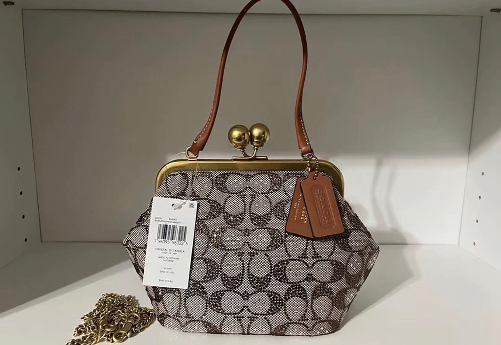 Coach Kisslock Frame Bag in Crystal Signature Jacquard.