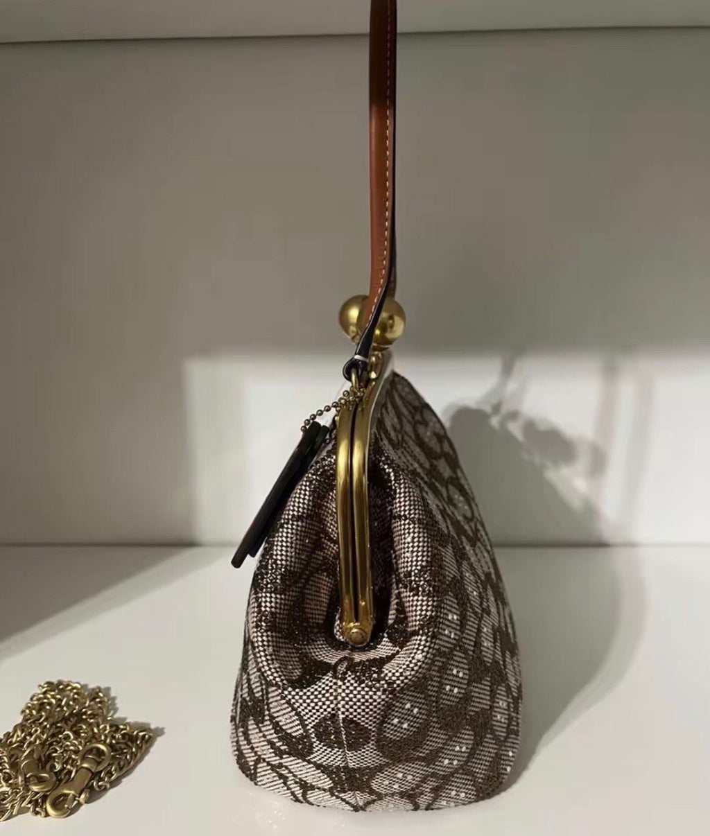 Coach Kisslock Frame Bag in Crystal Signature Jacquard.